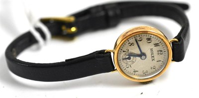 Lot 5043 - A lady's 9ct gold wristwatch, signed Rolex, 1936, lever movement, silvered dial with Arabic...