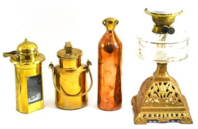 Lot 5053 - Glass oil lamp on a gilt painted base, brass lamp, brass can and copper flask