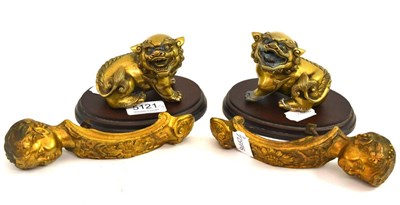 Lot 5121 - A pair of bronze kylin and a pair of brass cherub mounts