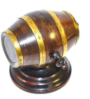 Lot 5134 - A 19th century walnut string box carved as a brass bound barrel enclosing a spool, on a...