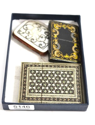 Lot 5146 - A tooled leather card case with flip-out aide memoire, an Indian card case and another purse...