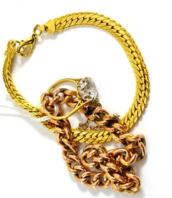 Lot 5149 - A curb bracelet, stamped '9C', a 9ct gold cubic zirconia ring and a gilt metal bracelet (3)