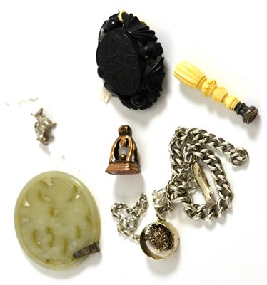 Lot 5177 - Small jade roundel, two seals, charm bracelet etc