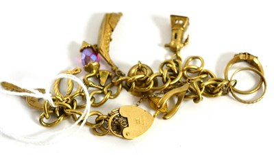 Lot 5187 - A charm bracelet hung with nine charms