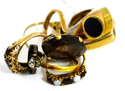 Lot 5188 - Four 9ct gold stone set rings, a smoky quartz ring and two other rings (7)