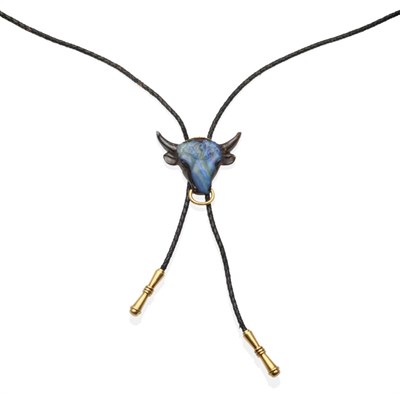 Lot 334 - A Carved Bolder Opal Bull's Head Bolo Tie, by Gübelin, the slide realistically carved with a...