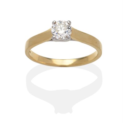 Lot 337 - An 18 Carat Gold Diamond Solitaire Ring, a round brilliant cut diamond in a white claw setting,...