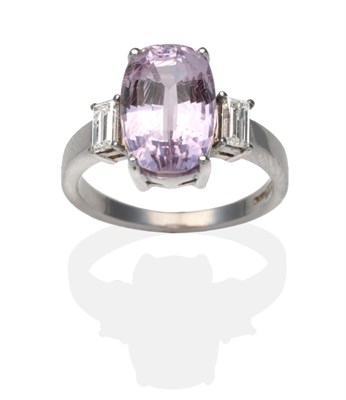 Lot 344 - An 18 Carat White Gold Kunzite and Diamond Ring, an oval cut kunzite between baguette cut...