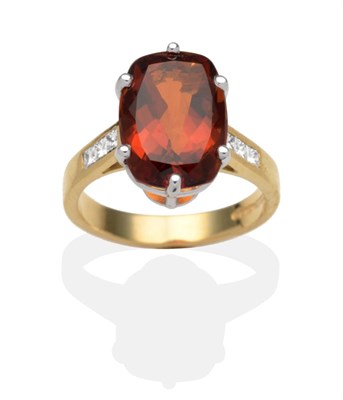 Lot 350 - An 18 Carat Gold Citrine and Diamond Ring, a cushion cut citrine in a white claw setting to...