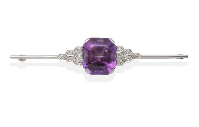 Lot 353 - An Art Deco Amethyst and Diamond Bar Brooch, an octagonal cut amethyst in a white claw setting...