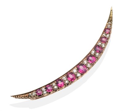 Lot 367 - A Ruby and Diamond Crescent Brooch, graduated oval cut rubies spaced by pairs of old cut...