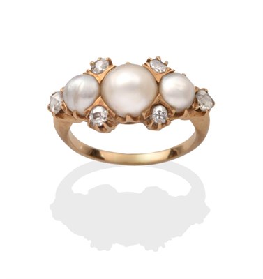 Lot 370 - A Pearl and Diamond Ring, three graduated button pearls spaced by four old cut diamond accents...