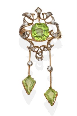 Lot 372 - A Peridot and Diamond Brooch/Pendant, an octagonal cut peridot in a yellow claw setting, within...