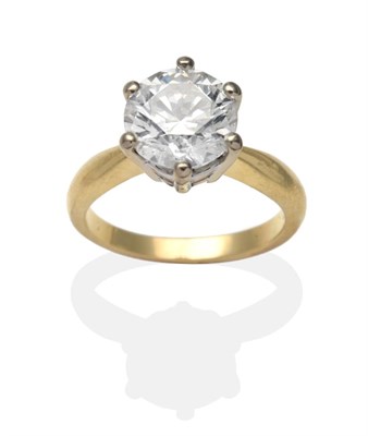 Lot 374 - An 18 Carat Gold Diamond Solitaire Ring, a round brilliant cut diamond in a white claw setting,...