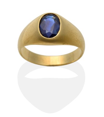 Lot 387 - A Sapphire Signet Ring, an oval cut sapphire inset to a yellow tapering mount, on a plain...