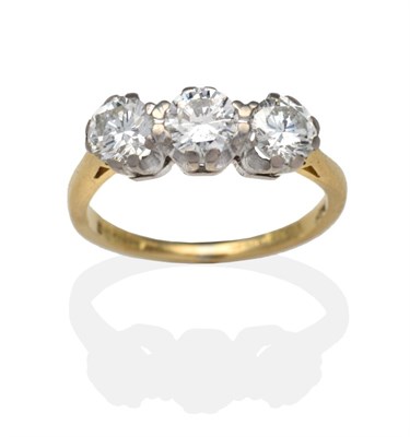 Lot 388 - An 18 Carat Gold Diamond Three Stone Ring, round brilliant cut diamonds in white claw settings,...