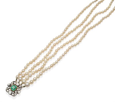 Lot 413 - A Pearl Necklace with an Emerald and Diamond Set Clasp, four strands of graduated pearls knotted to