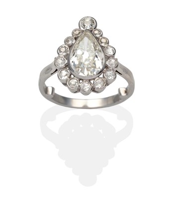 Lot 418 - A Pear Cut Diamond Cluster Ring, an old pear cut diamond within a conforming border of...