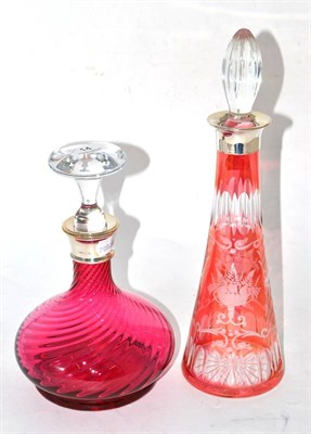 Lot 14 - Two cranberry glass silver mounted decanters