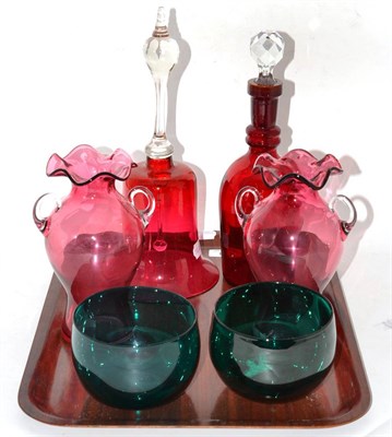 Lot 24 - A tray of cranberry glass including two vases, decanter, a bell and two green glass bowls
