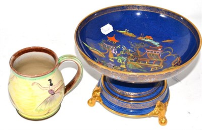 Lot 26 - A Carlton ware pedestal bowl on stand and a pottery mug decorated with dancers, signed to the base