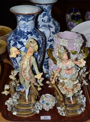Lot 43 - Continental porcelain comprising pair of figures, two floral encrusted vases and a pair of...