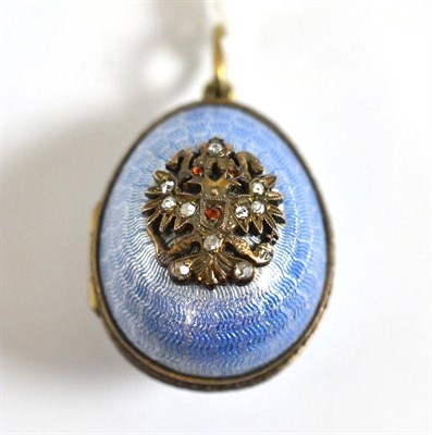 Lot 72 - A Russian silver enamel and diamond egg pendant