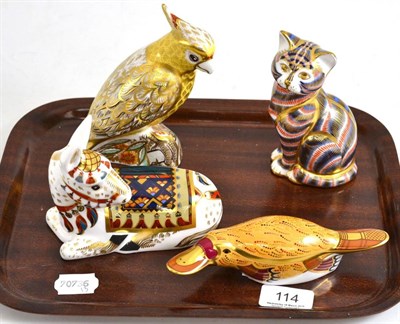 Lot 114 - Four Royal Crown Derby figures including seated cat, donkey, citron cockatoo and a platypus