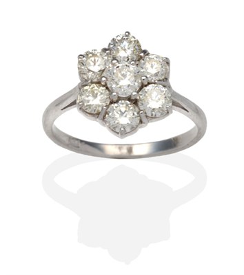 Lot 441 - A Diamond Cluster Ring, seven round brilliant cut diamonds in white claw settings, to knife...