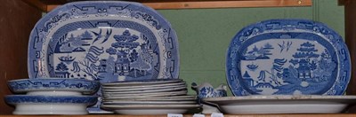 Lot 122 - A shelf of 19th century blue and white Willow pattern pottery