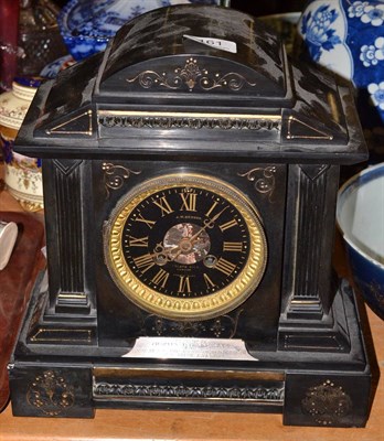 Lot 161 - A black slate striking mantel clock, retailed by J W Benson with presentation plaque