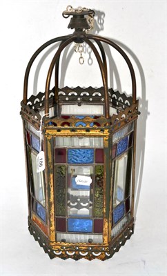 Lot 188 - A late Victorian hanging brass lantern of hexagonal form with coloured glass panels