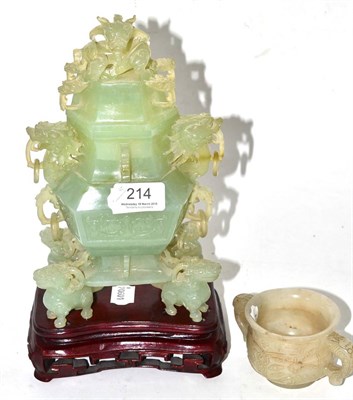 Lot 214 - A Chinese carved green hardstone vase and cover, hardwood stand and a Chinese white hardstone...