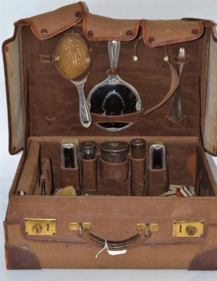 Lot 230 - Leather dressing case with canvas outer case, enclosing tortoiseshell and silver mounted...