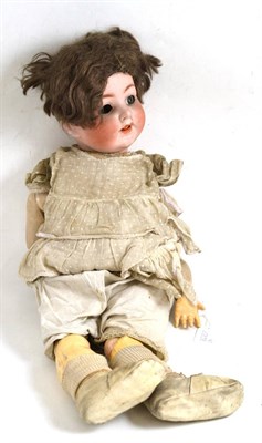 Lot 235 - Bisque head child doll with articulated tongue and flirty eyes