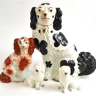 Lot 248 - Large 19th century black and white spaniel, another smaller and a pair of white poodles