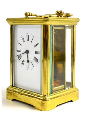 Lot 319 - Brass cased carriage clock, key and leather case