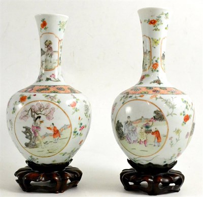 Lot 322 - Pair of Chinese baluster vases on hardwood stands