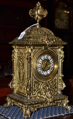 Lot 356 - A gilt metal striking mantel clock, circa 1890, urn finial and scroll decoration, 3-3/4-inch...