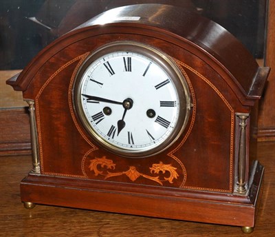 Lot 360 - An inlaid striking mantel clock