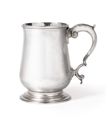 Lot 477 - An Early George III Silver Mug, Thomas Wallis, London 1768, of plain baluster shape on circular...