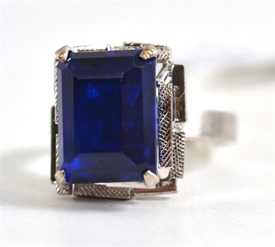 Lot 378 - A blue paste ring on shank stamped ";18K"