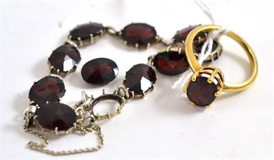 Lot 383 - A 9ct gold garnet ring, a garnet bracelet and a loose stone (3)