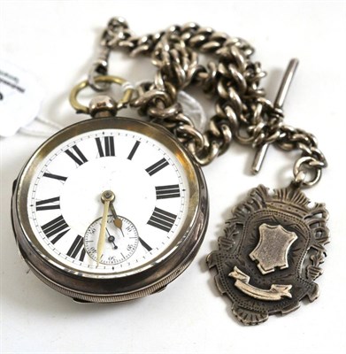 Lot 385 - A silver pocket watch, silver watch chain and attached silver fob