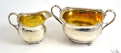 Lot 403 - George III silver sugar basin and matching cream jug, by the Barnards