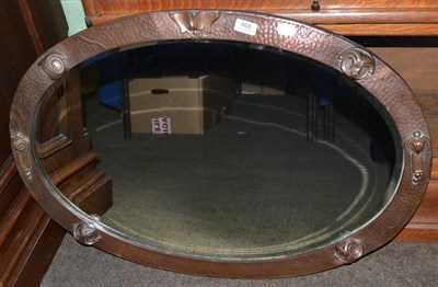 Lot 468 - Copper framed bevelled oval wall mirror in Arts & Crafts style