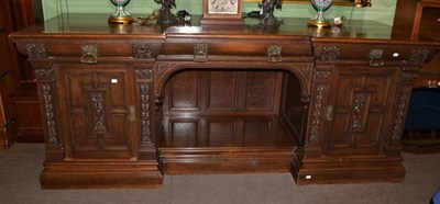 Lot 471 - Large Victorian carved oak sideboard bearing label Hampton & Sons Pall Mall, London