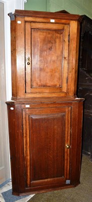 Lot 483 - A George III oak corner cupboard and a pine corner cupboard