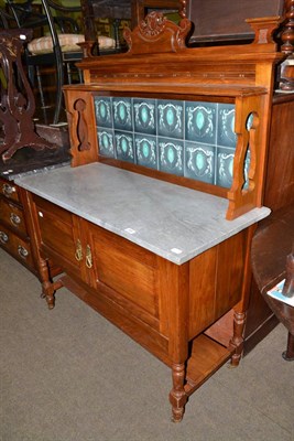 Lot 495 - Late Victorian walnut washstand with marble top and tiled back