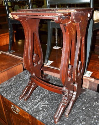 Lot 496 - 19th century Chinese export nest of three brown lacquer tables